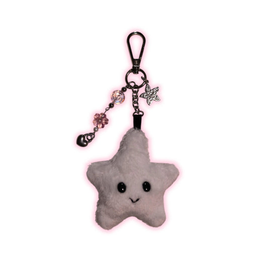 Star-shaped plush keychain with a smiling face on a white background