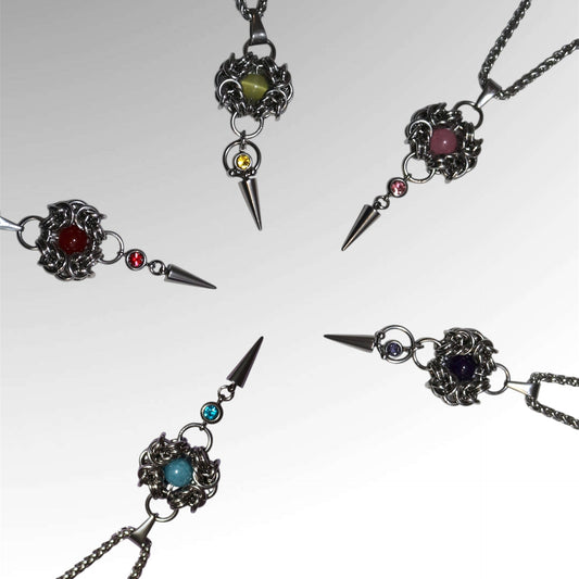 romanov chainmail pendants of different colors on white background