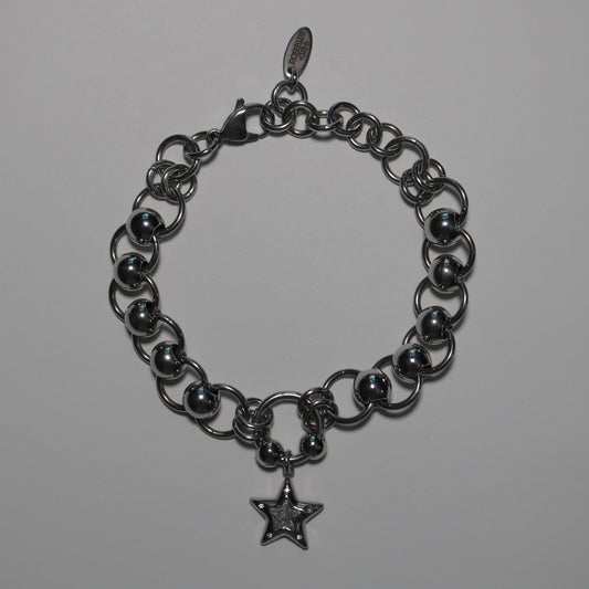 chain bracelet with star charm on a white background