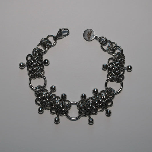 chainmail 4 in 1 bracelet with barbells on a white background