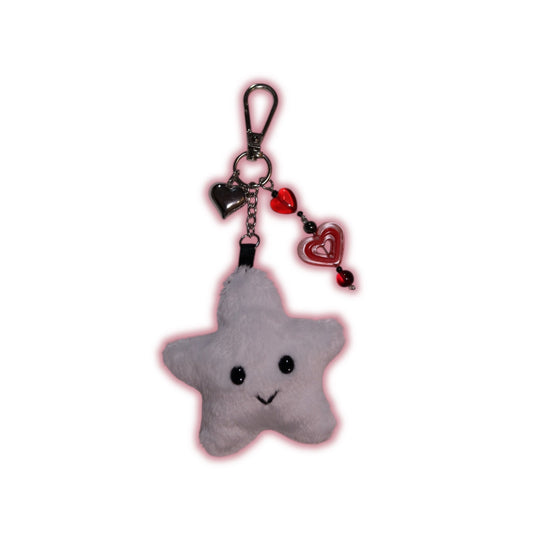 Gray star-shaped keychain with a smiley face on a white background