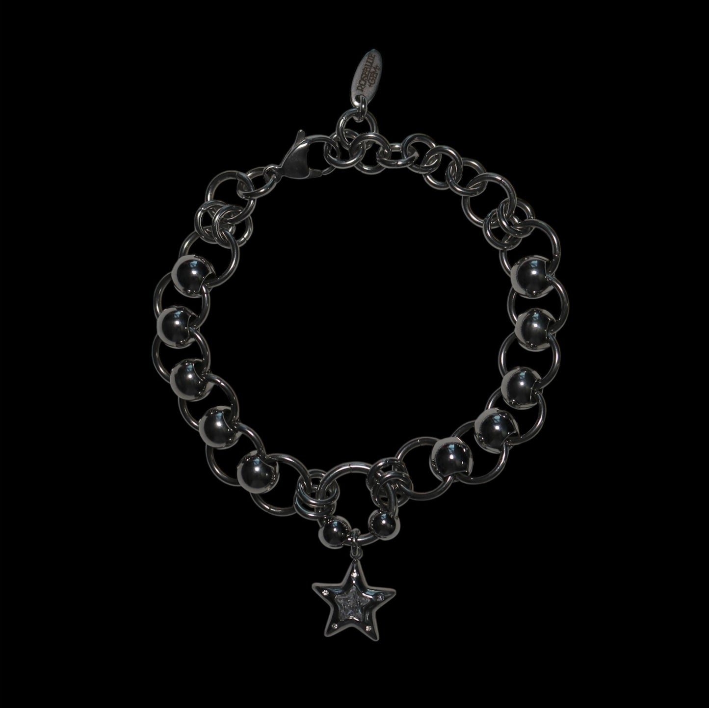 Silver chain bracelet with a star charm on a black background