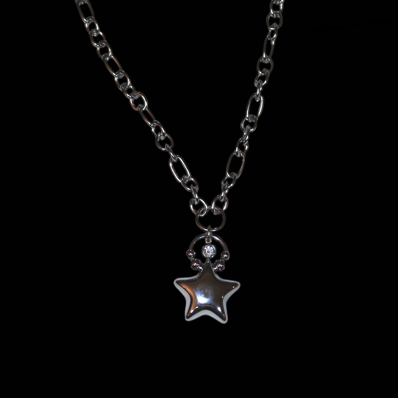 Star pendant necklace on a black background