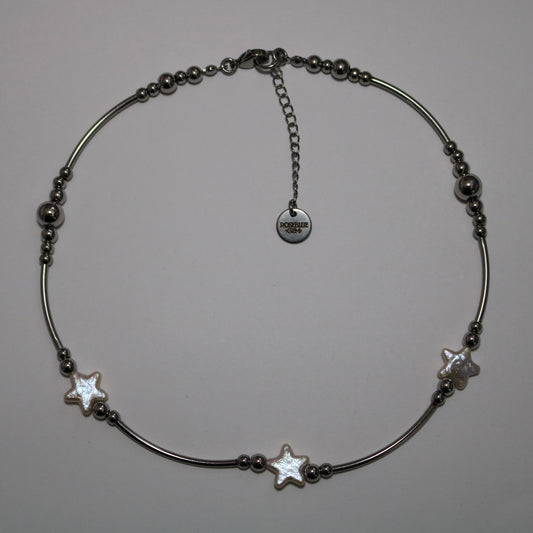 Necklace with stainless steel tube beads and star shape pearls on a white background