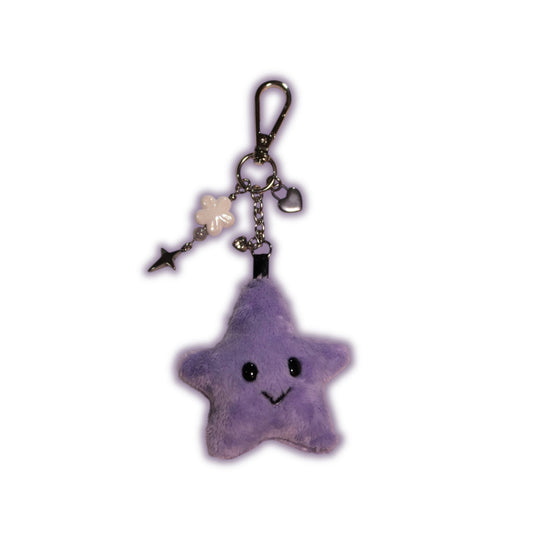 Purple star-shaped keychain with a smiling face on a white background