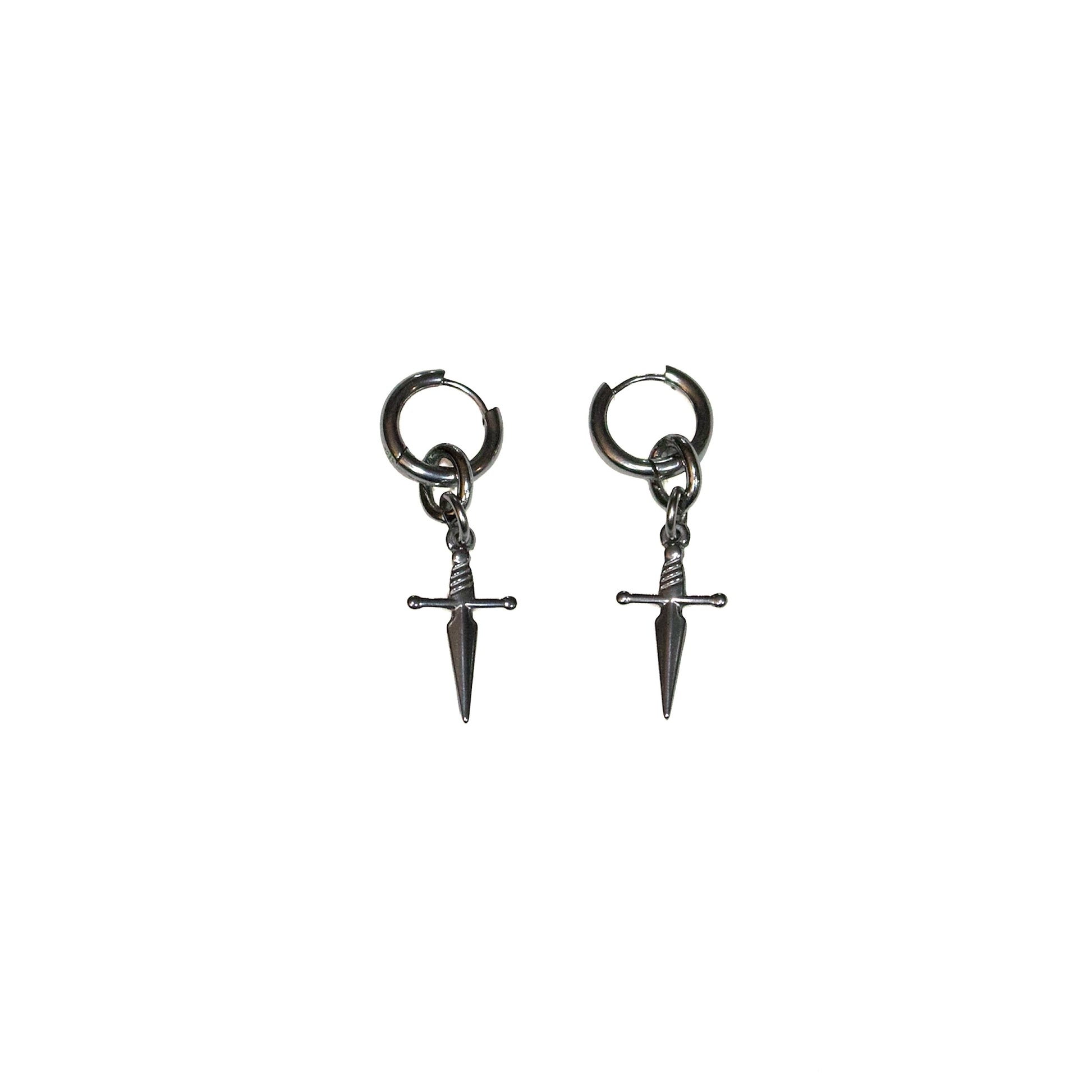 Pair of stainless steel dagger-shaped huggie earrings on a white background