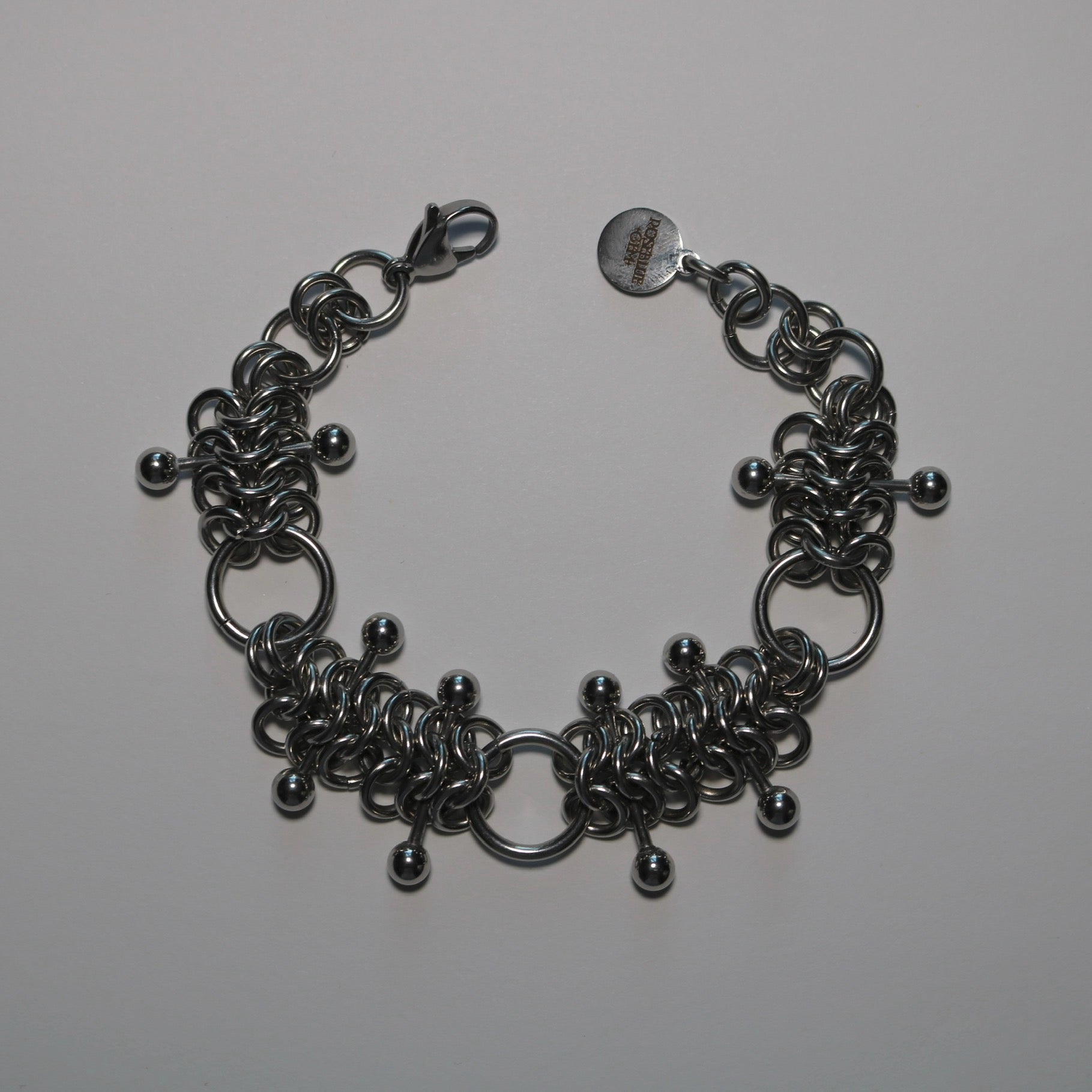 chainmail 4 in 1 bracelet with barbells  on a white background
