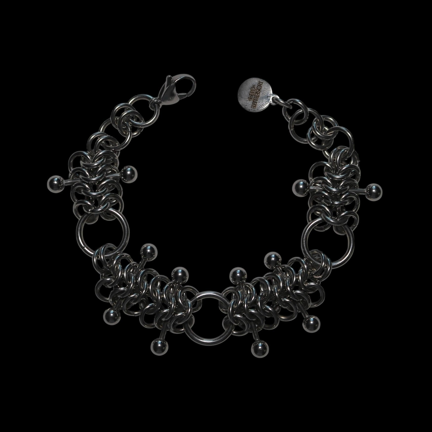 chainmail 4 in 1 bracelet with barbells  on a black background