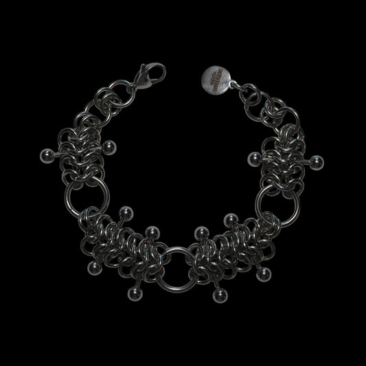 chainmail 4 in 1 bracelet with barbells  on a black background