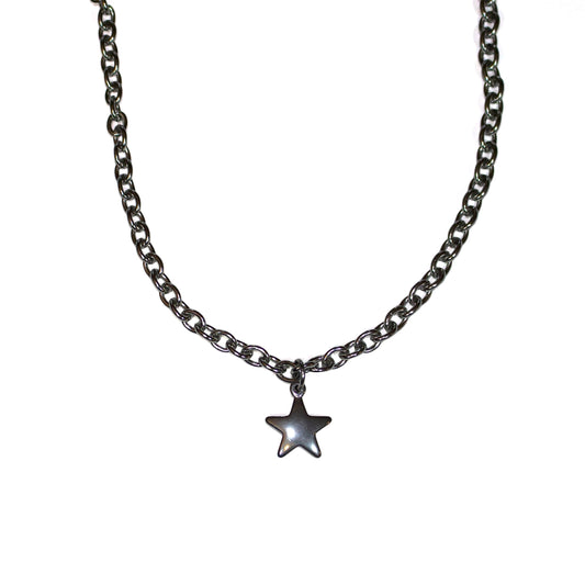 Star-shaped pendant on a chain against a white background